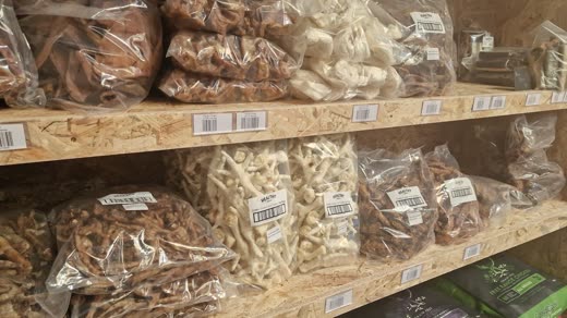 Shelves of bagged natural dog chews and treats
